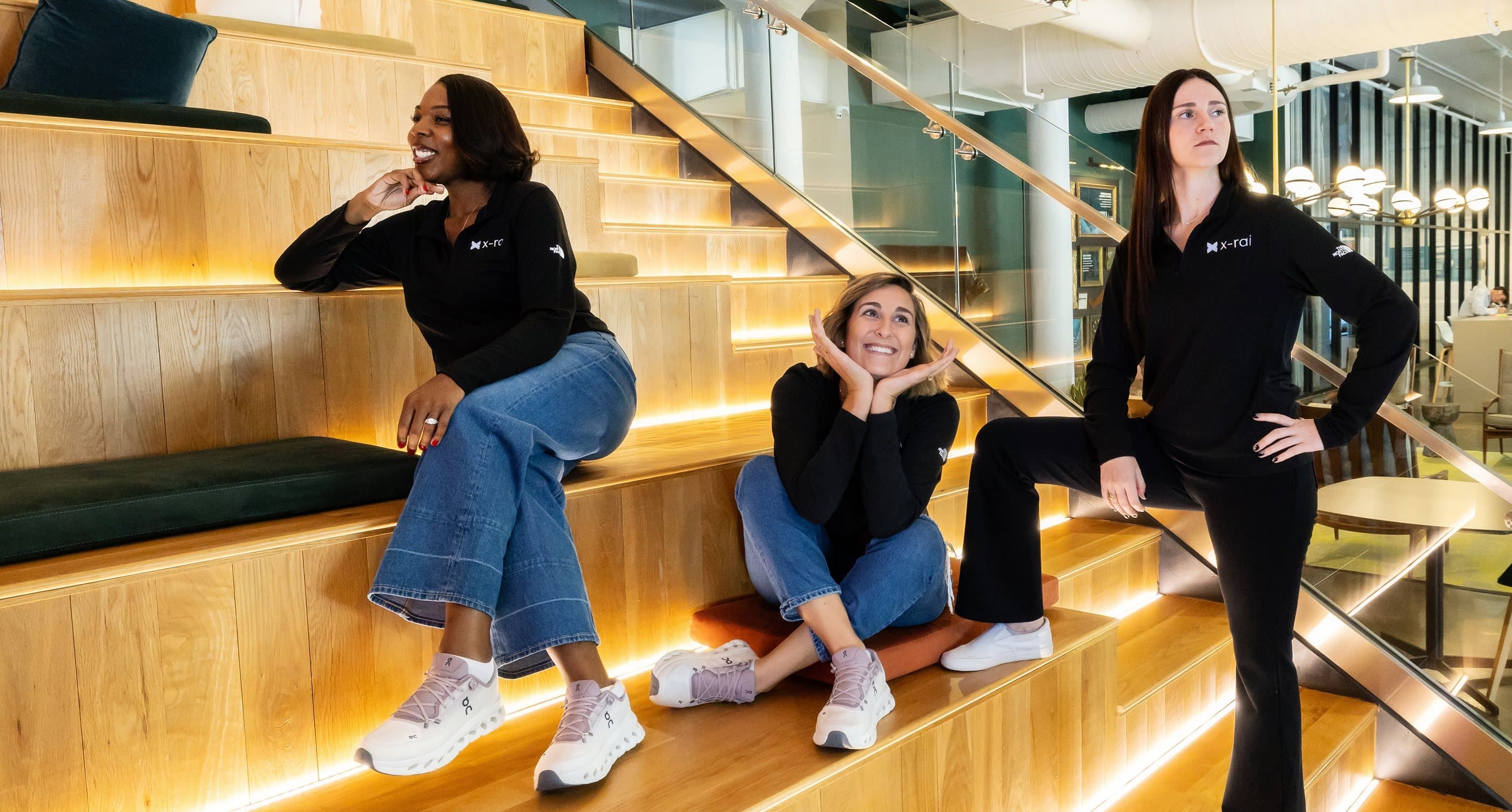 The same team, being silly on the office stairs